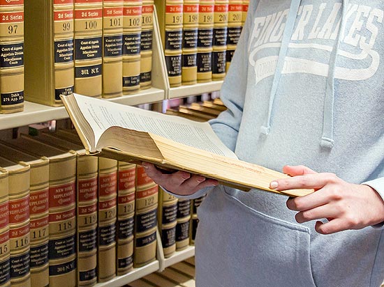 Student reading law book