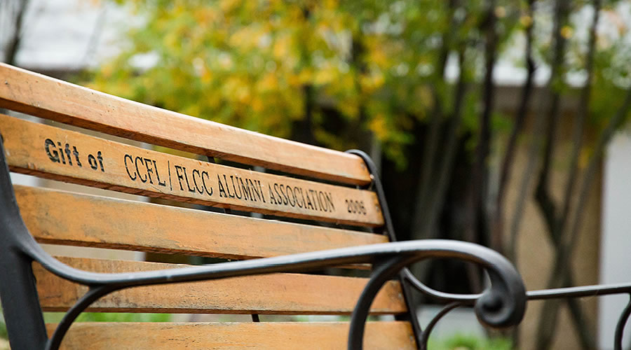 Park bench with words Gift of CCFL and FLCC Alumni Association 2006