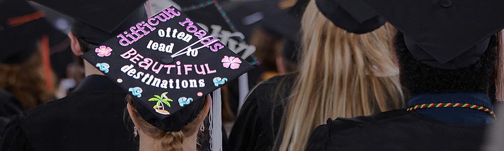 FLCC graduate with the message difficult roads often lead to beautiful destinations printed on graduation cap