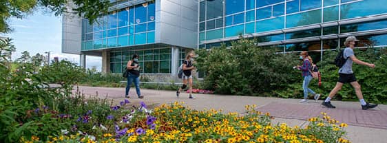 FLCC students walking near the main entrance of the Student Center on the FLCC Canandaigua Campus