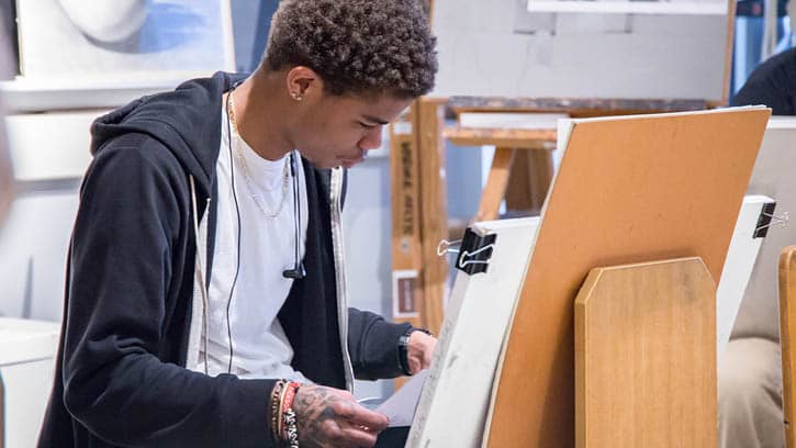 Student working on an art project in the drawing studio.