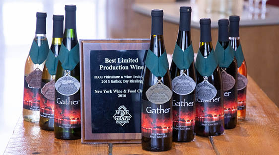 The 2015 Gather vintage displayed with one gold, three silver, and four bronze medals awarded by the New York Wine Classic.